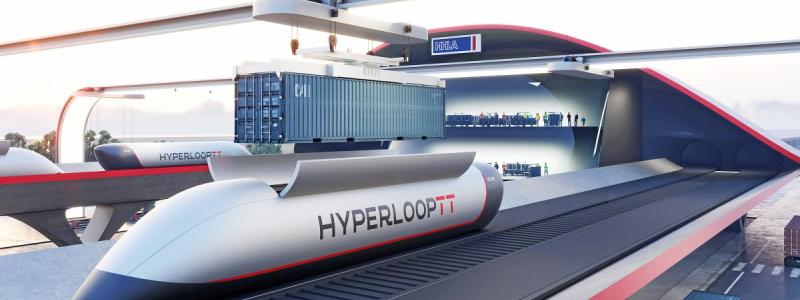 HHLA Hyperport i simuleringen: En automatiskt arbetande kran sänker en container i lastplatsen på en Hyperloop-kapsel innan den skjuts in i röret. Foto: HHLA. Kredit: Mormedi