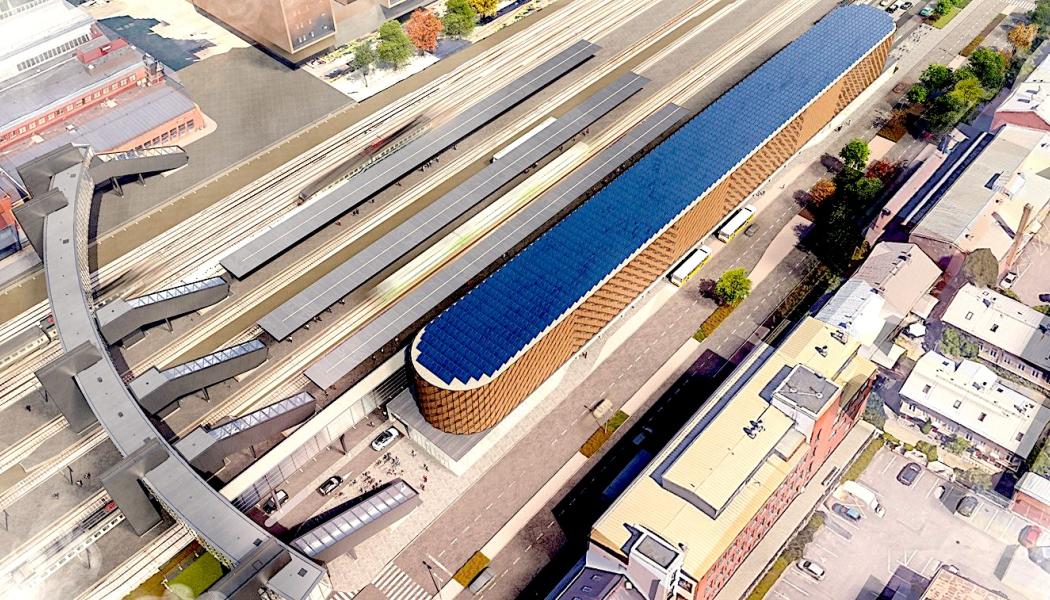 Nya stationstjänster för tågresenärer som avgår från och anländer till Åbo planeras redan till år 2025. Sunborn Group, som är moderbolag till Logomo Oy, planerar en femvånings stationsbyggnad på en tomt vid gatan Ratapihankatu bredvid Logomobron (till vänster i bilden). Samtidigt skulle företagen, besökarna och invånarna i Logomo och det nya utvecklande bangårdsområdet få mycket efterlängtade parkeringsplatser. Planeringsbild: Åbo Stad


